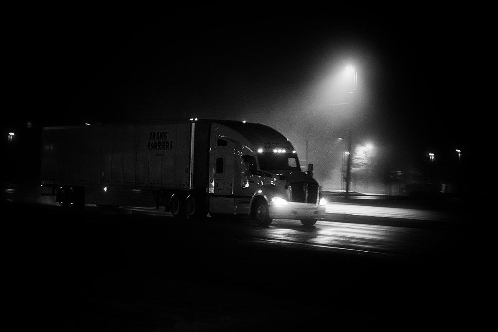 Illustrative photograph of a Semi Truck In the Rain At Night
